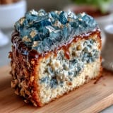 Elegant teal and gold geode graduation cake with shimmering sugar crystals and metallic gold accents, perfect for honoring a graduate's achievement.