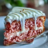 Decadent Rosé Velvet Cake, frosted and boasting a luxurious cascading gold glaze.